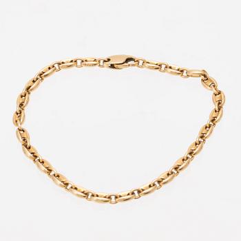 An 18K gold bracelet by Cartier.
