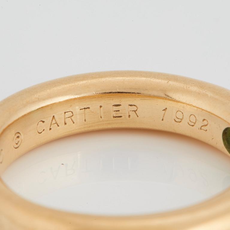 Cartier tre ringar "Ellipse" 18K guld med fasettslipad safir, smaragd och rubin.