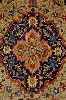A CARPET, a semi-antique Tabriz, ca 342 x 269 cm.