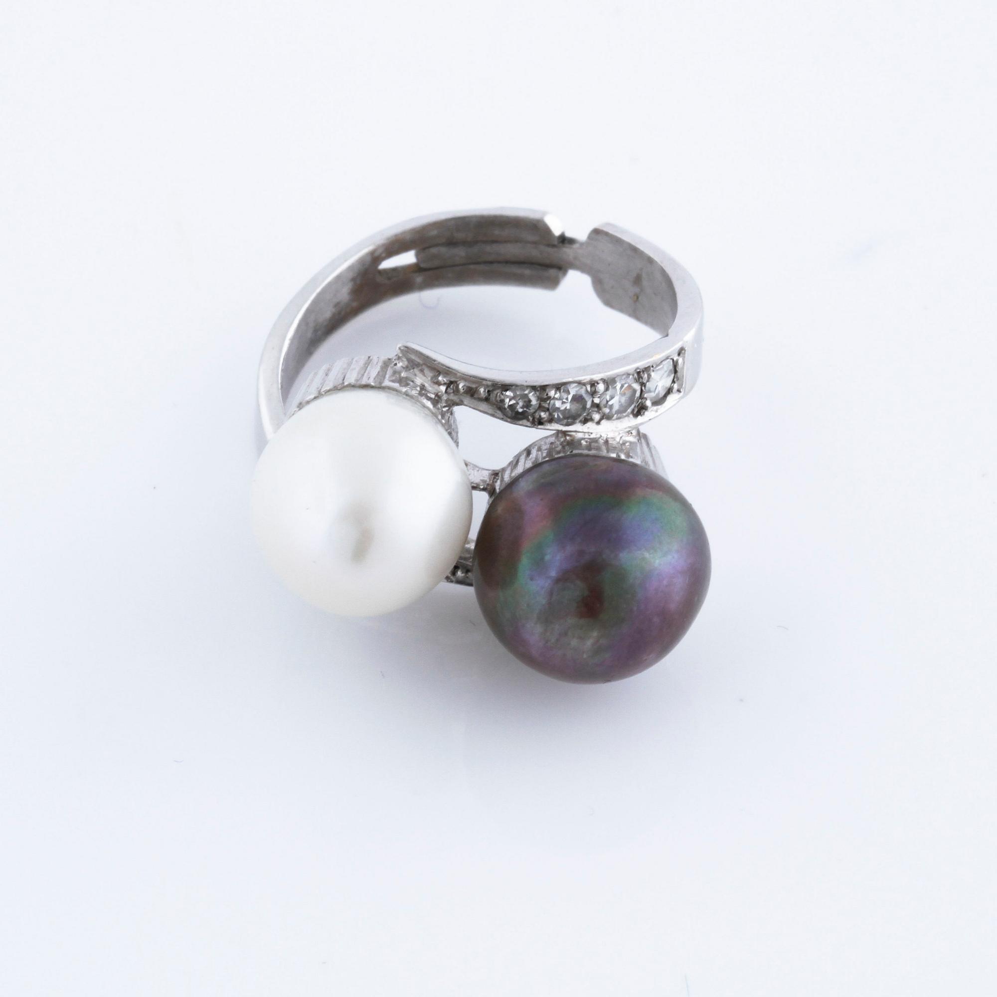 A cultured pearl and single cut diamond ring.