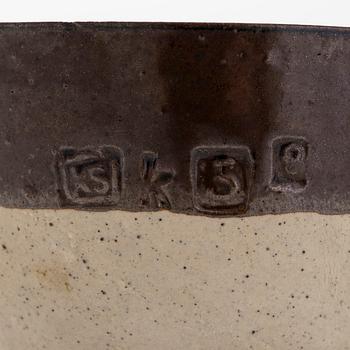 Kyllikki Salmenhaara, a stoneware tea strainer signed KS.