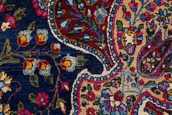 A semi-antique Kirman carpet, south Persia, c. 440 x 279 cm.