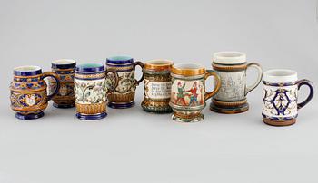 A set of eight majolica mugs from Rörstrand, around the turn of the century 1900.