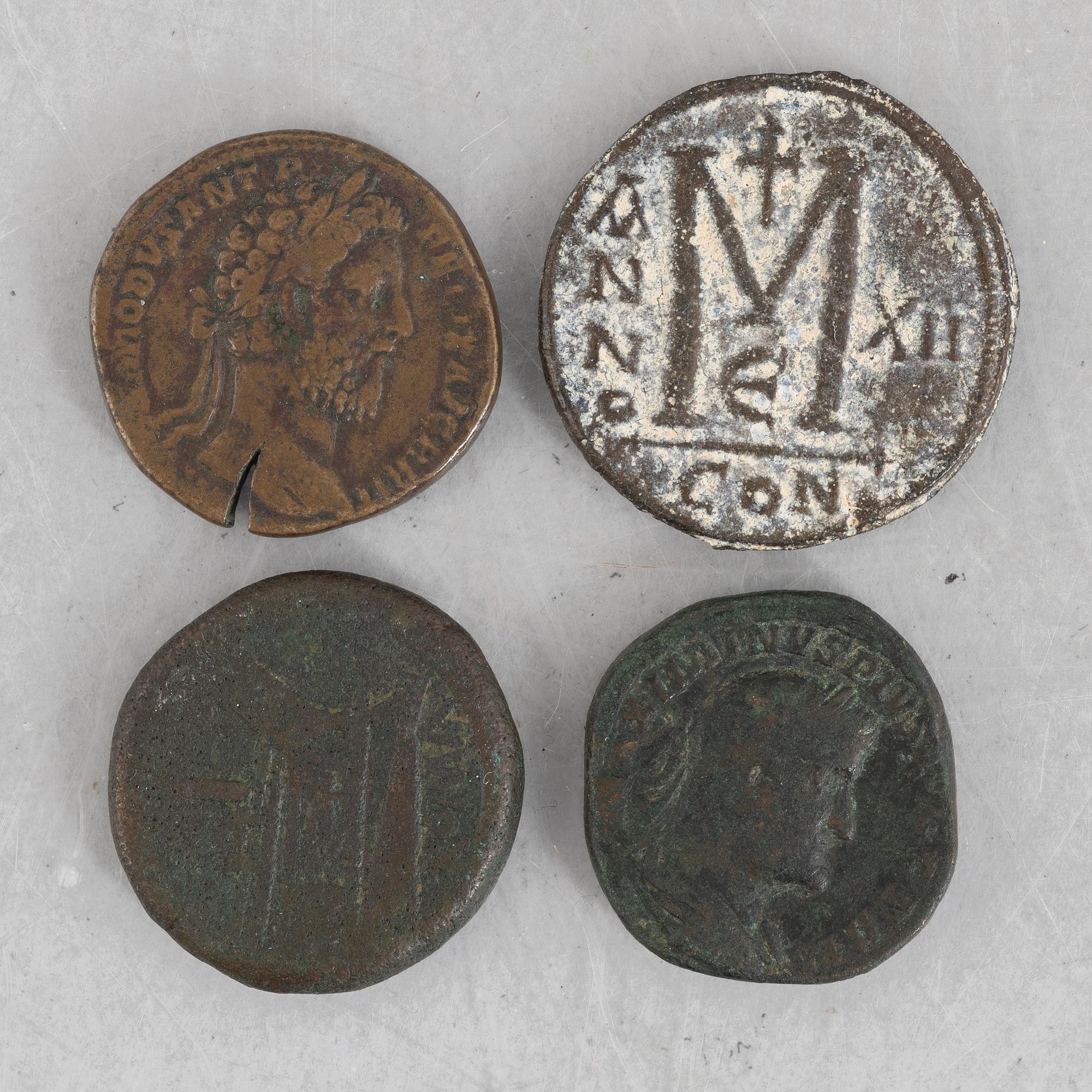 Four Roman coins.