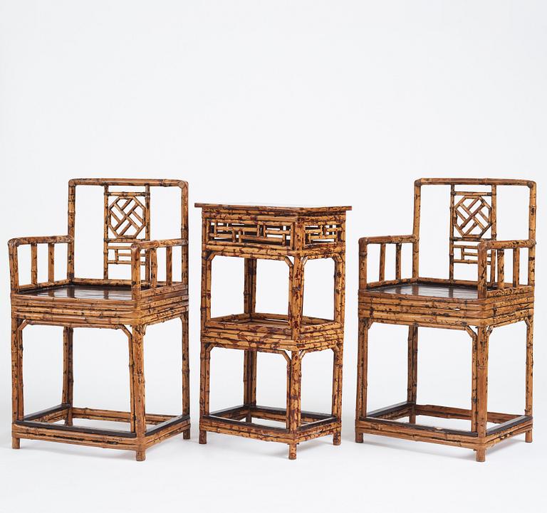 A pair of spotted bamboo chairs and a table, Qing dynasty, 19th Century.