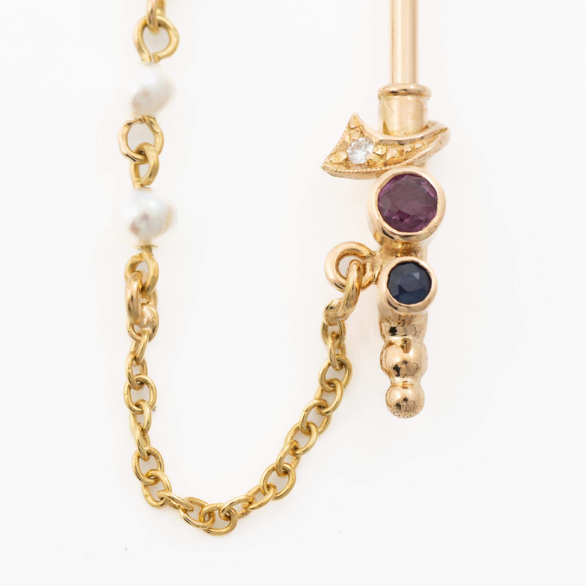 Lapel pin, 18K gold with brilliant-cut diamonds, sapphires, a ruby and pearls.