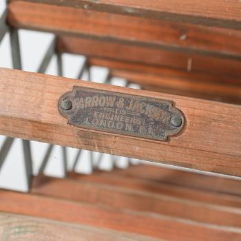 A wine rack from Farrow & Jackson, England, 20th century.