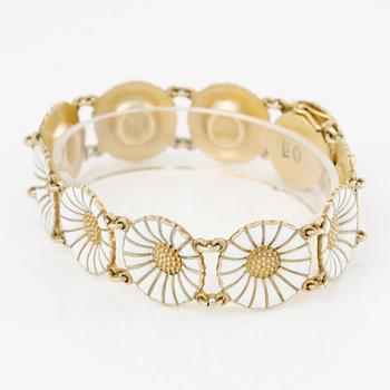 Georg Jensen and A Michelsen "Daisy" a bracelet, a pendant, and a brooch silver gilt and enamel.