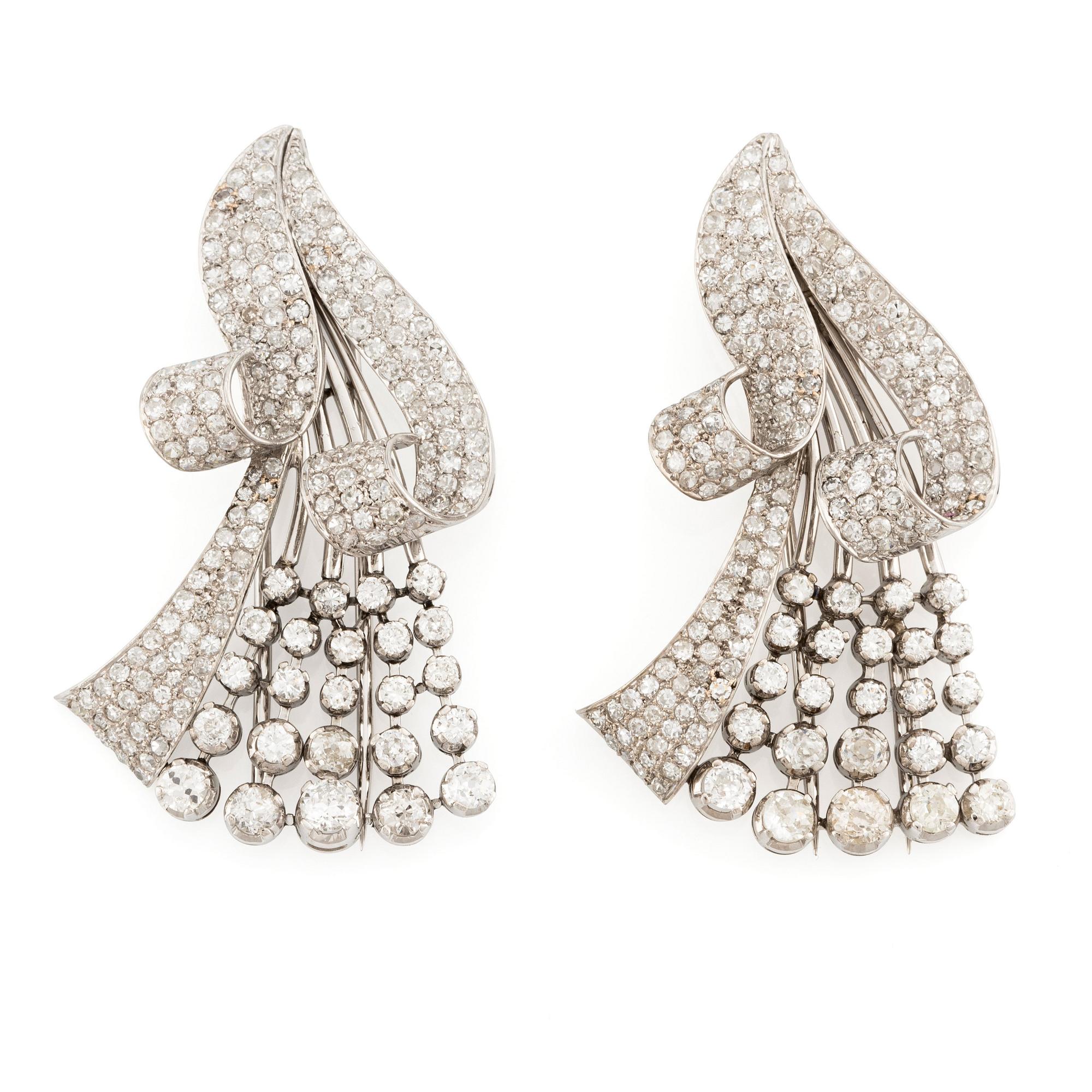 A pair of platinum brooches with old-cut, round brilliant-cut and single-cut diamonds.