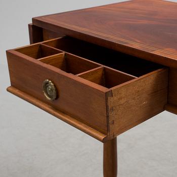 A Swedish first half of the century Karl Johan style mahogany veneered table.