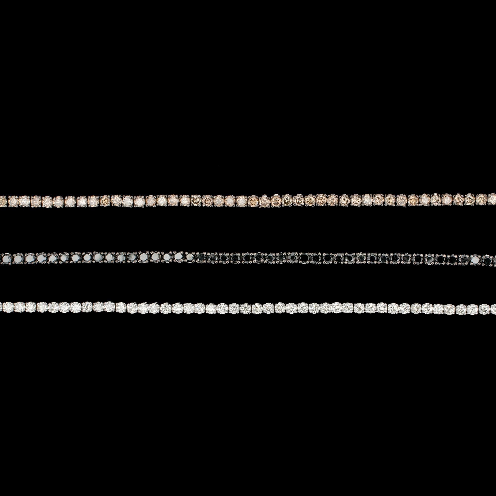 ARMBAND, 3 st, vita- svarta- och cognacsfärgade briljantslipade diamanter, tot. ca 9 ct.