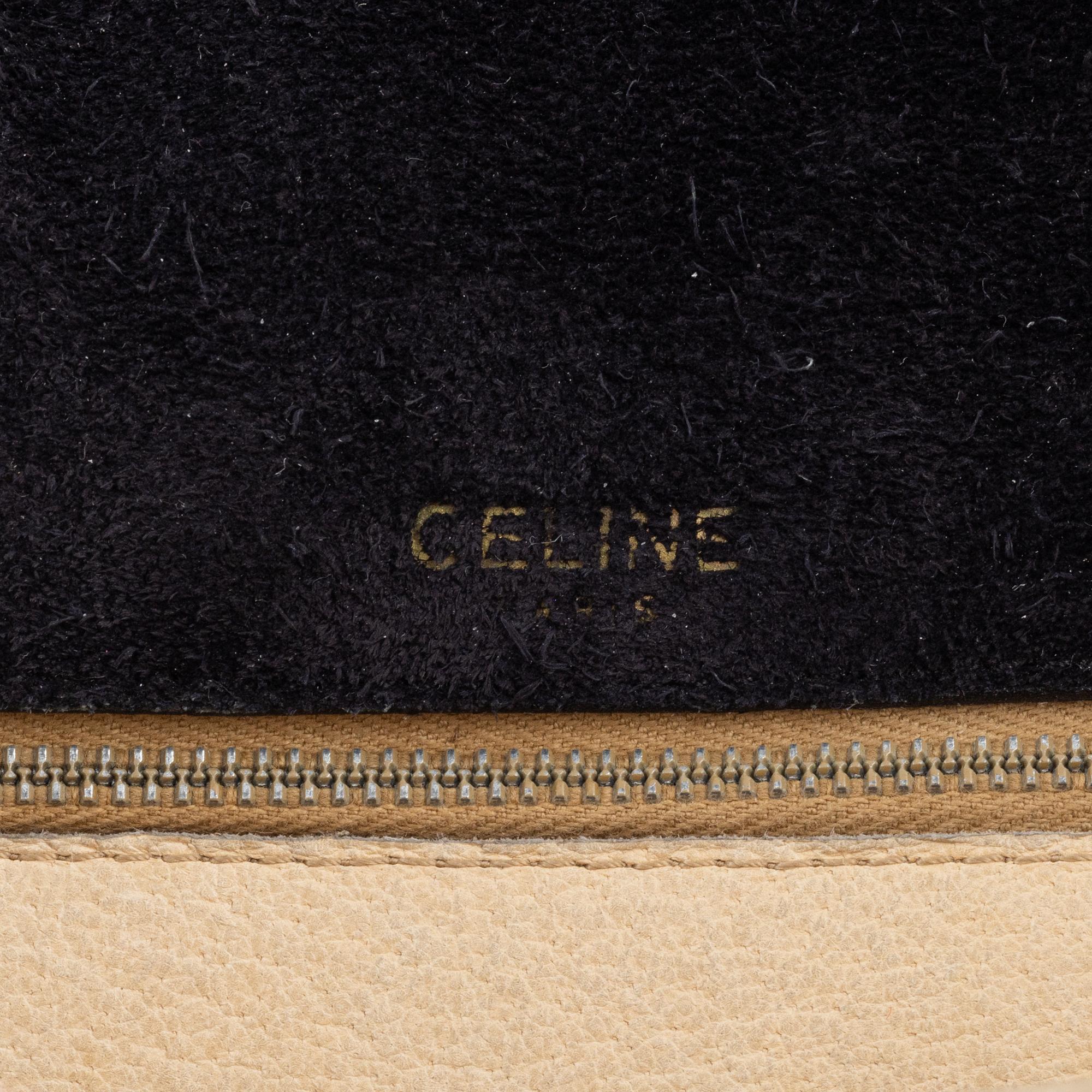 Céline, a black suede handbag.