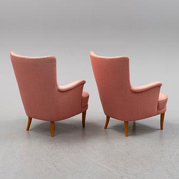 A pair of Carl Malmsten easy chairs.