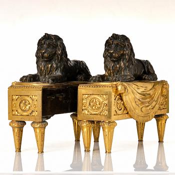 A pair of Louis XVI gilt and patinated bronze chenets.