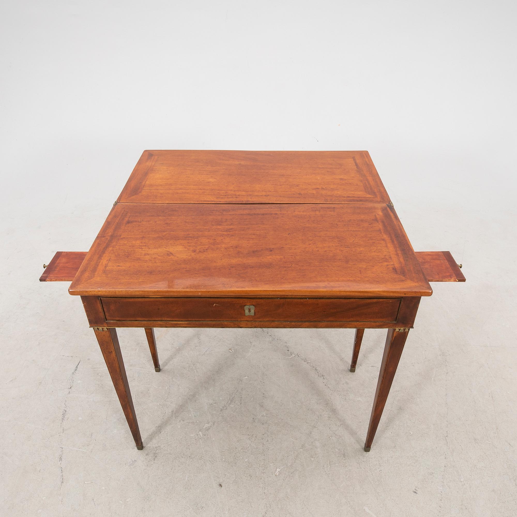 A late Gustavian mahogany game table first half of the 19th century.