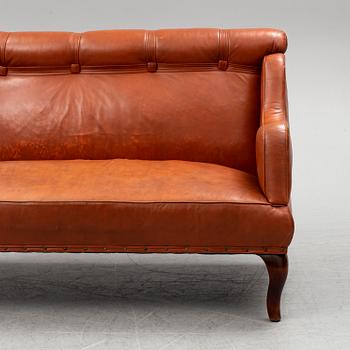 An early 20th century leather sofa.