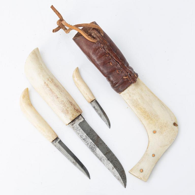 Half-horn knives, cup, bottle, needle case.