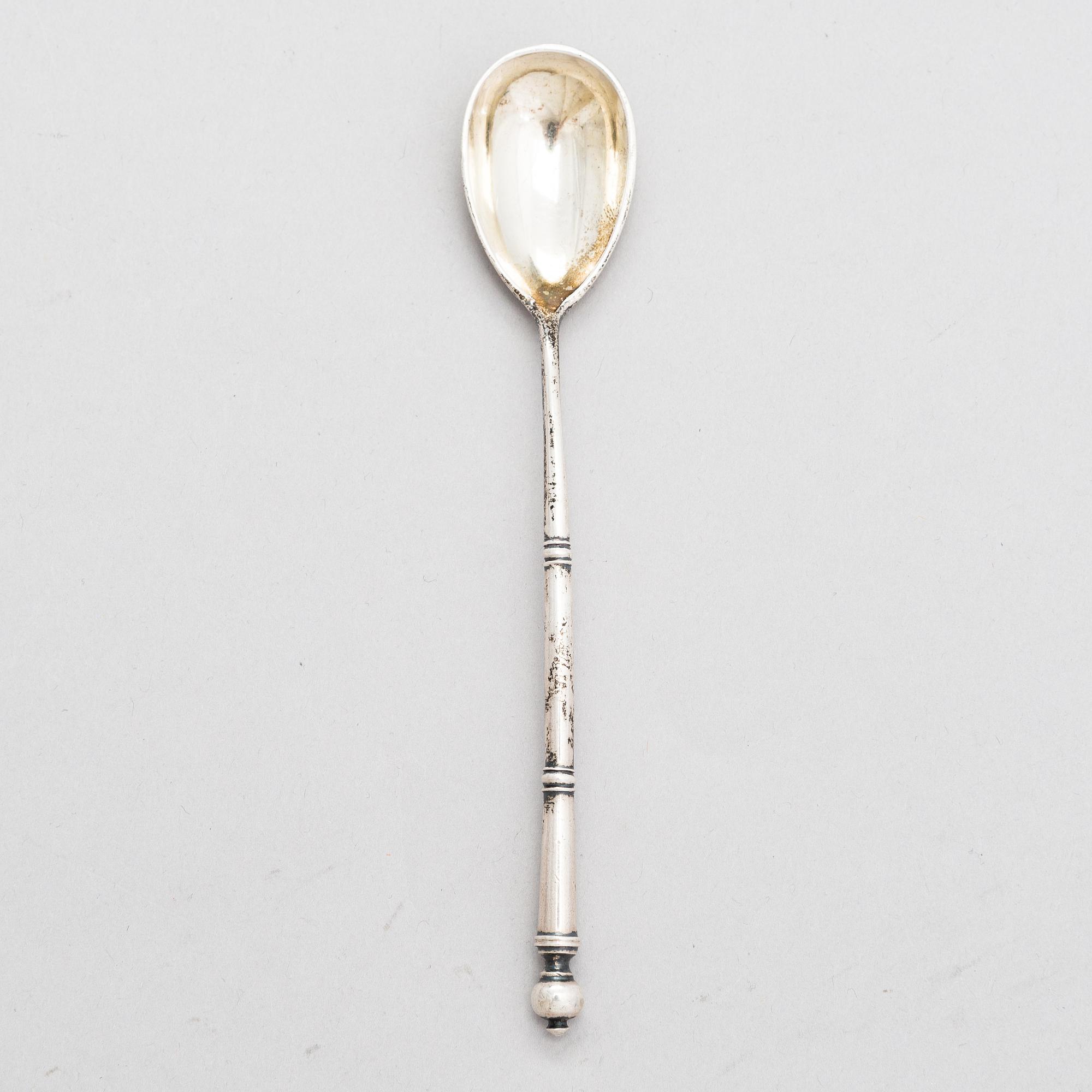 A Russian silver tea glass holder and a tea spoon, Moscow, Alexander Fuld 1889 and Antip Kuzmichev 1888. Glass, Finland.