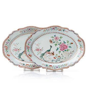 1061. A pair of famille rose 'double peacock' serving dishes, Qing dynasty, Qianlong (1736-95).