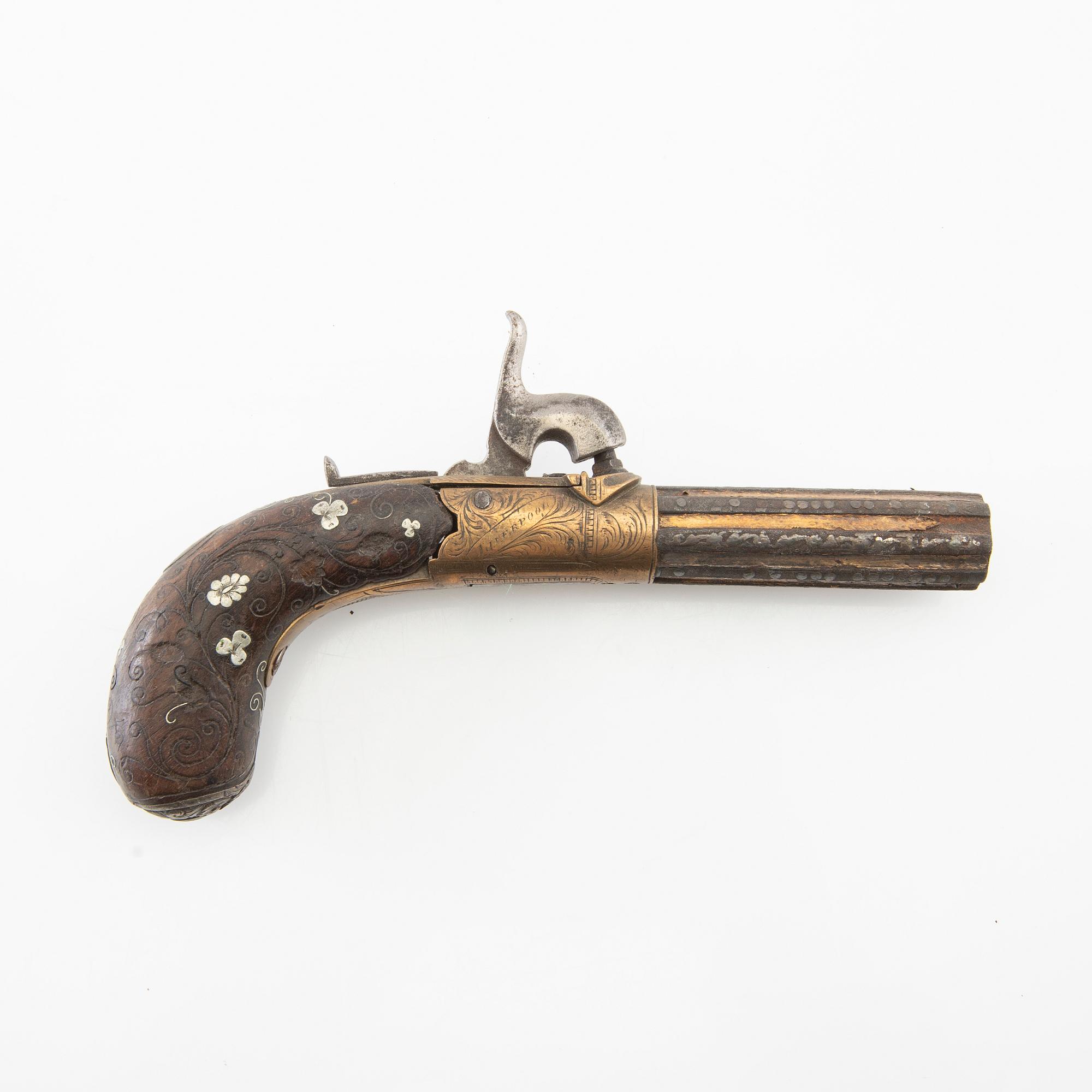 A British percussion pistol, 19th century.
