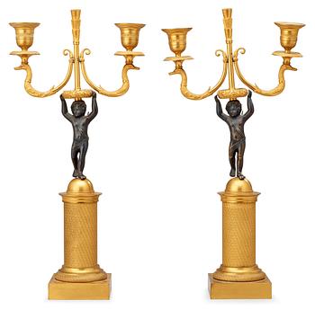 549. A pair of French Empire early 19th century two-light candelabra.