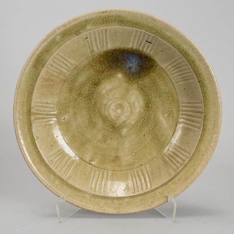 A celadon glazed dish, South East Asia, Sawankhalok, 16th Century.