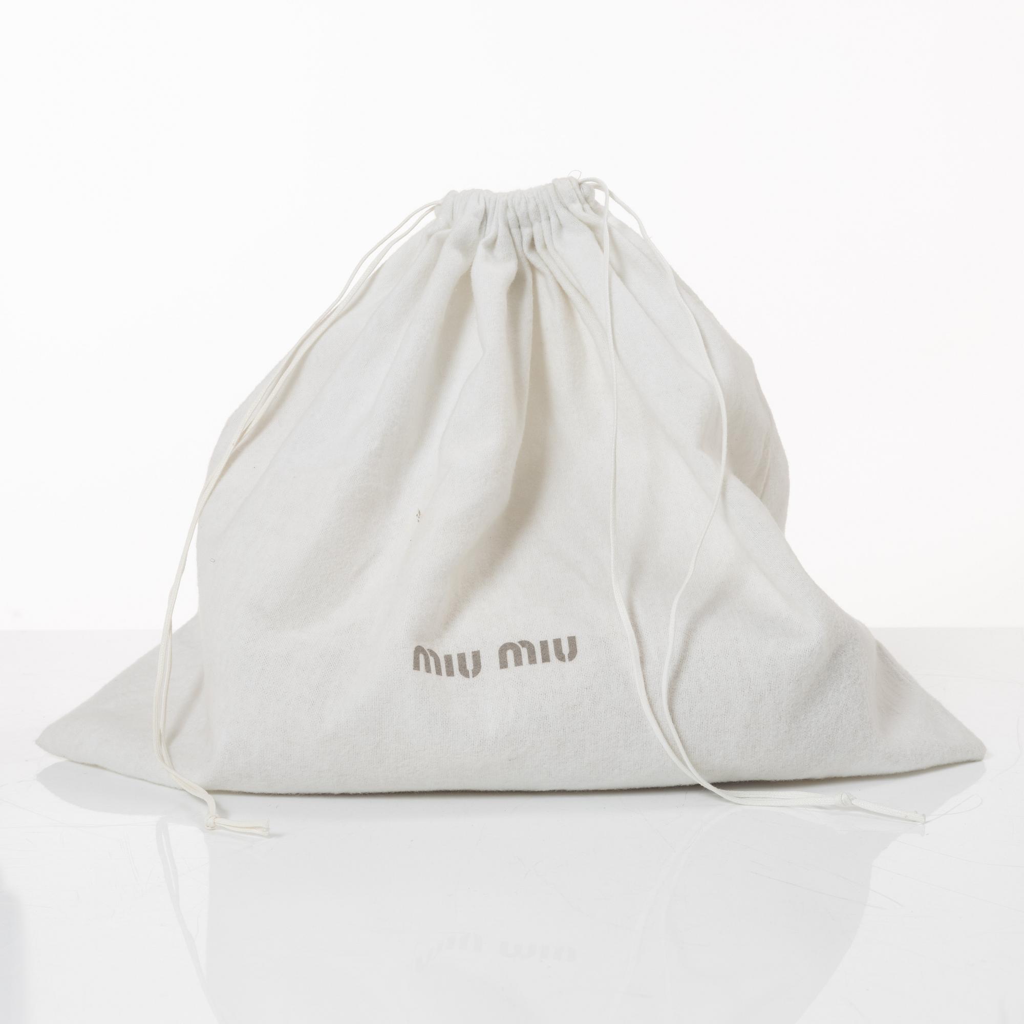 Miu Miu, a handbag.