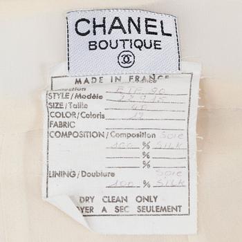 CHANEL, a bonewhite silk skirt. French size 40.