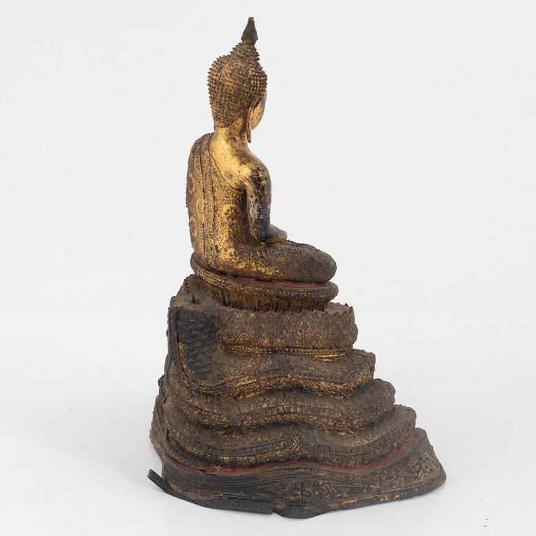 A gilt bronze Rattanakosin Buddha on a Naga throne, Thailand, 19th Century.