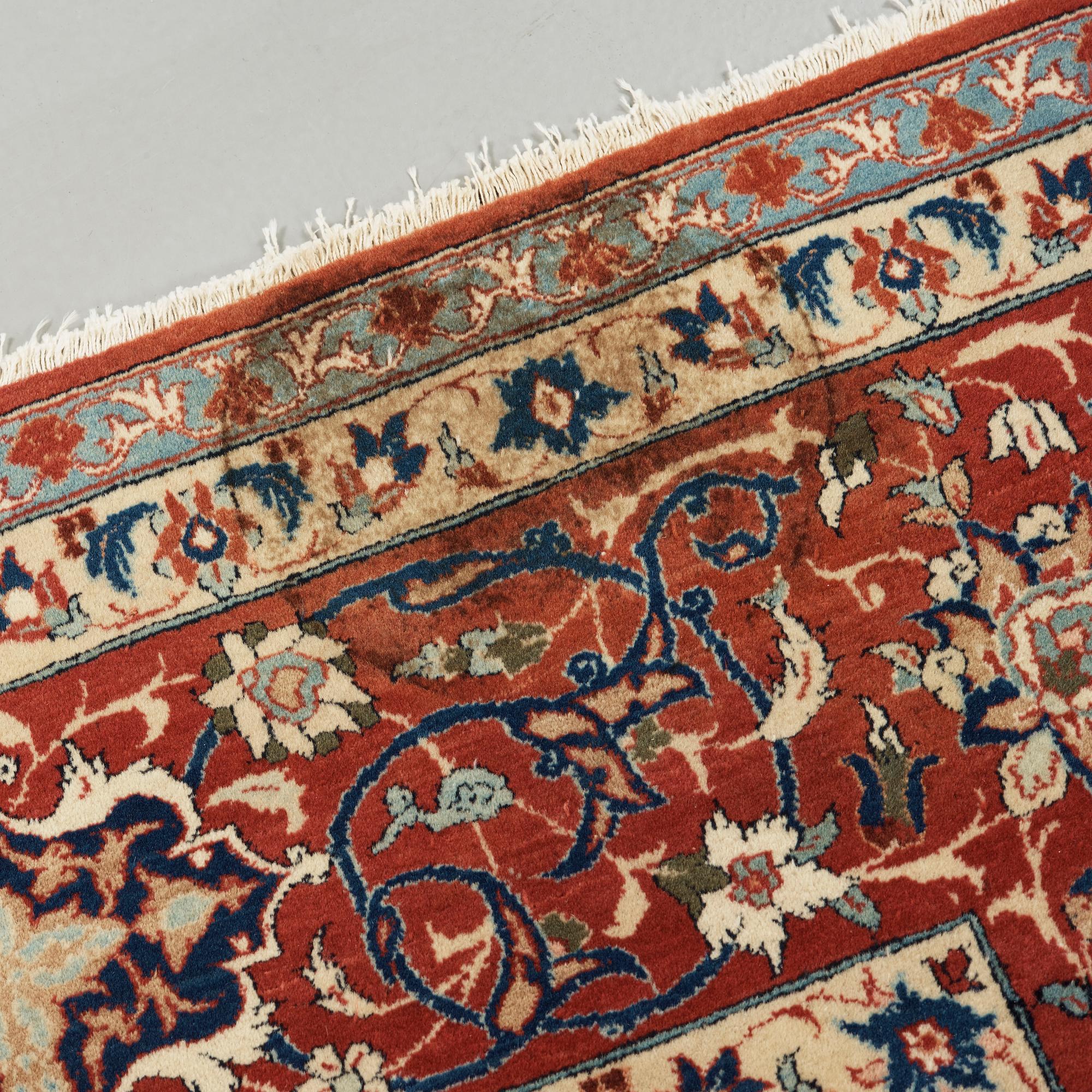 A old Esfahan carpet, around 299 x 210 cm.