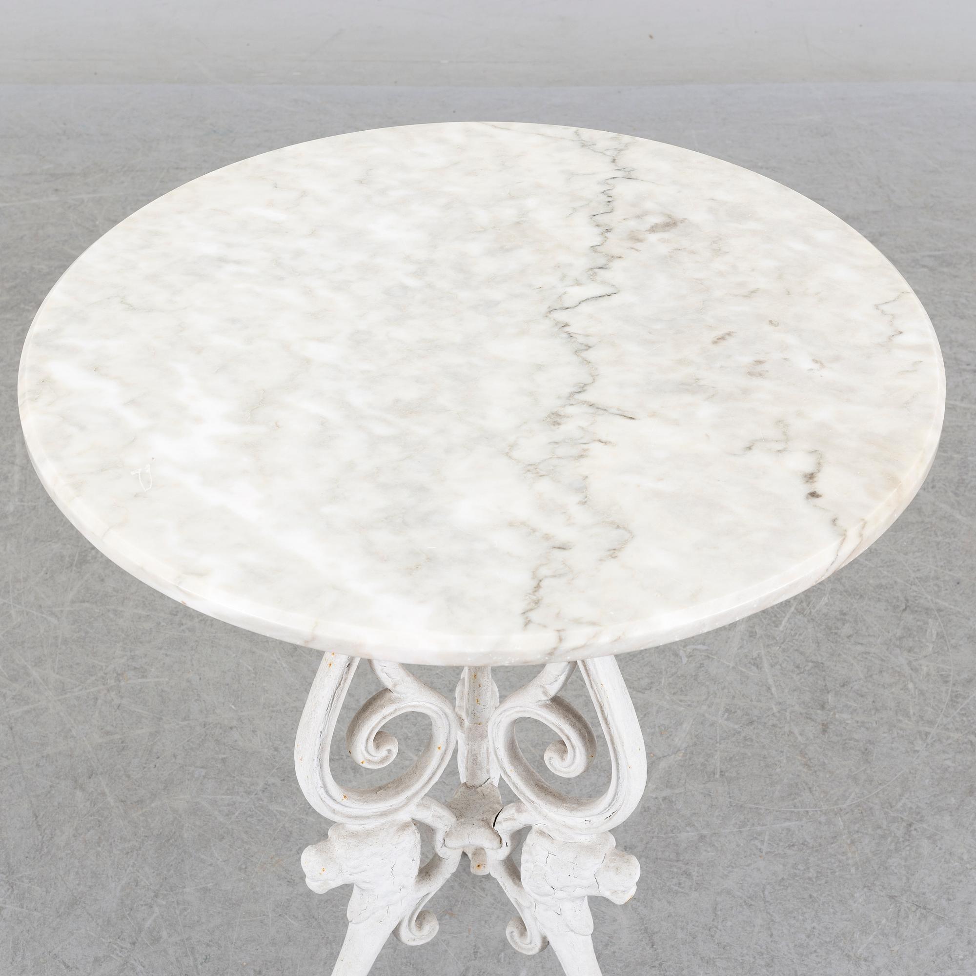 a late 20th century cast iron garden table.