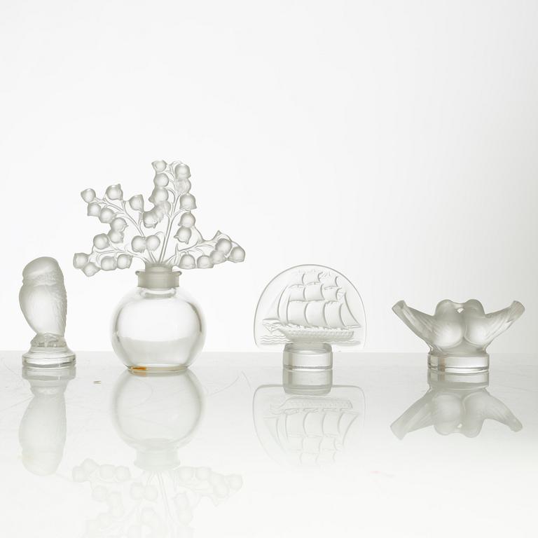 Lalique, four perfume bottles and five figurines, France, after 1945.