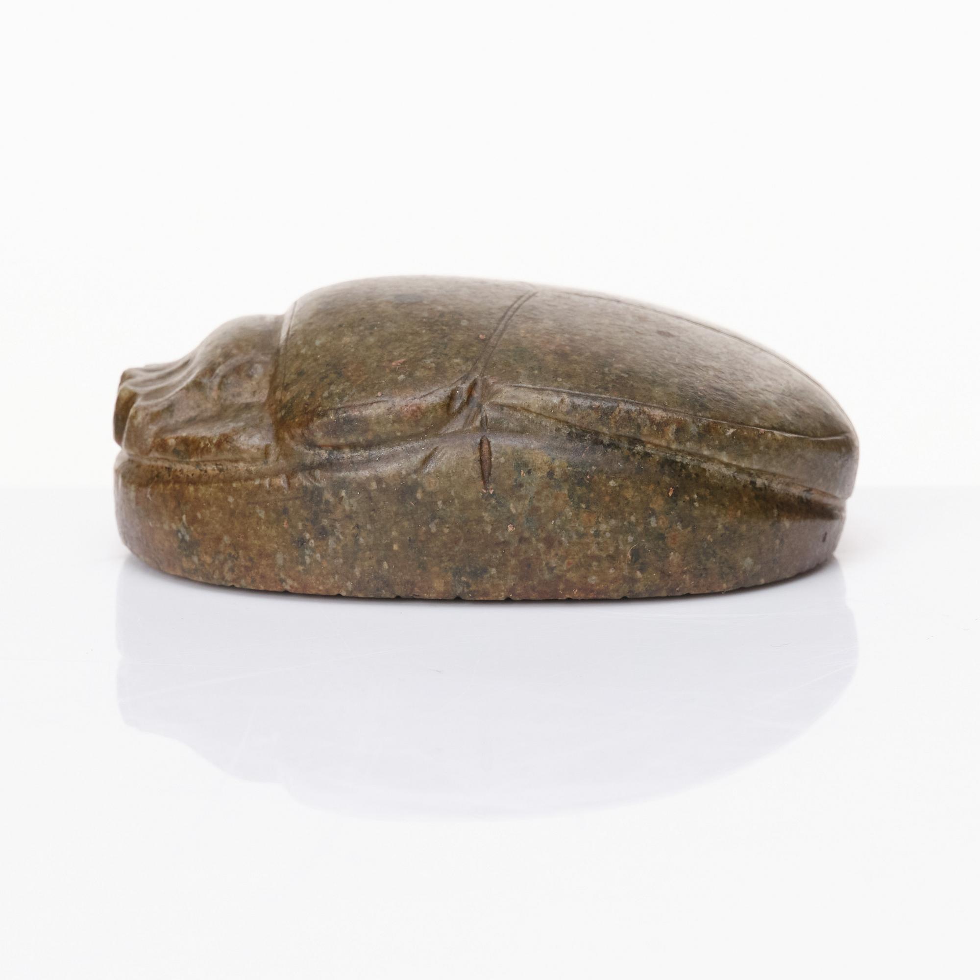 An Egyptian hardstone funerary scarab, probably Late Period, 26th-30th Dynasties, circa 664-343 B.C.