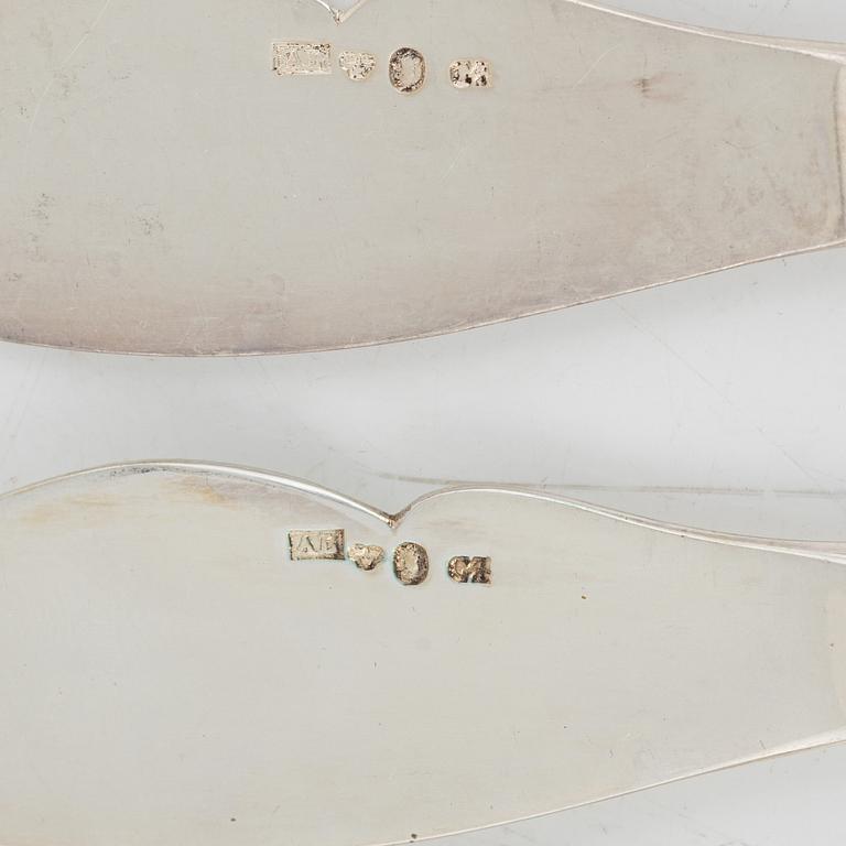 Four knives, a scissor and a spoon, including Anders Lunqvist, Stockholm 1833.