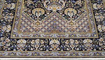 A Kashan rug, ca 206 x 143 cm.