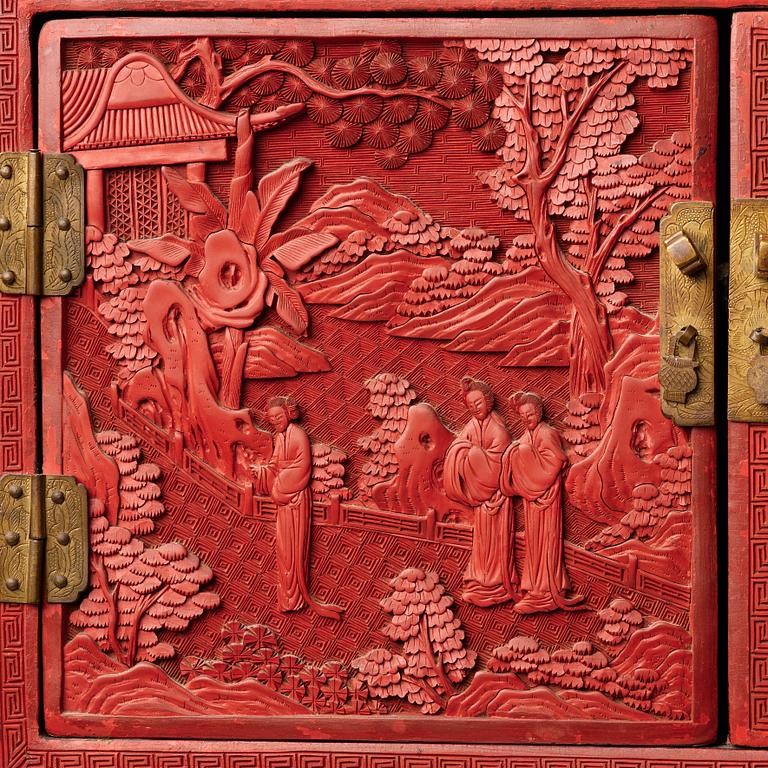 A carved  lacquer 'Kang'Cabinet, Qing dynasty, 18/19th Century.