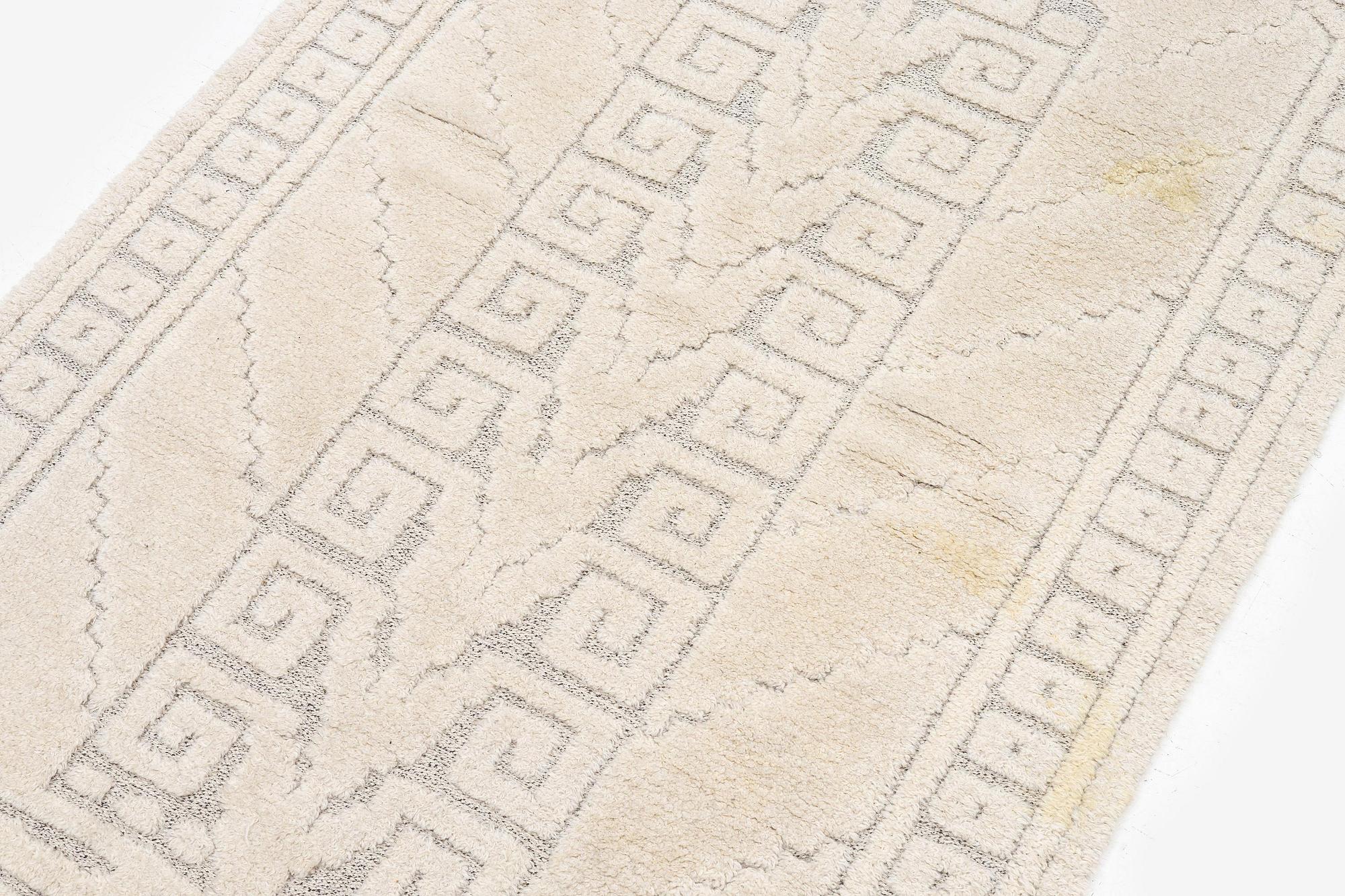Märta Måås-Fjetterström, a 'Vita spetsporten' carpet, knotted pile in relief,  c. 218 x 119 cm, signed AB MMF,