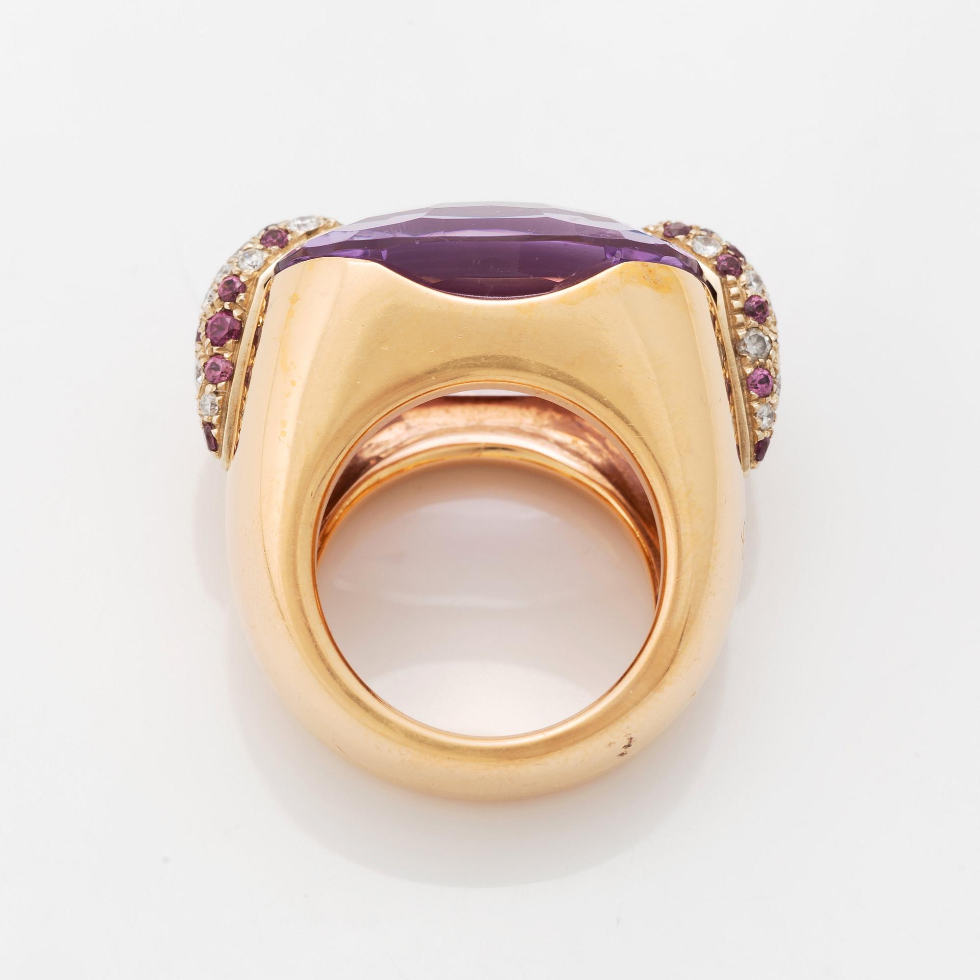 A Pomellato ring set with amethysts and round brilliant-cut diamonds.