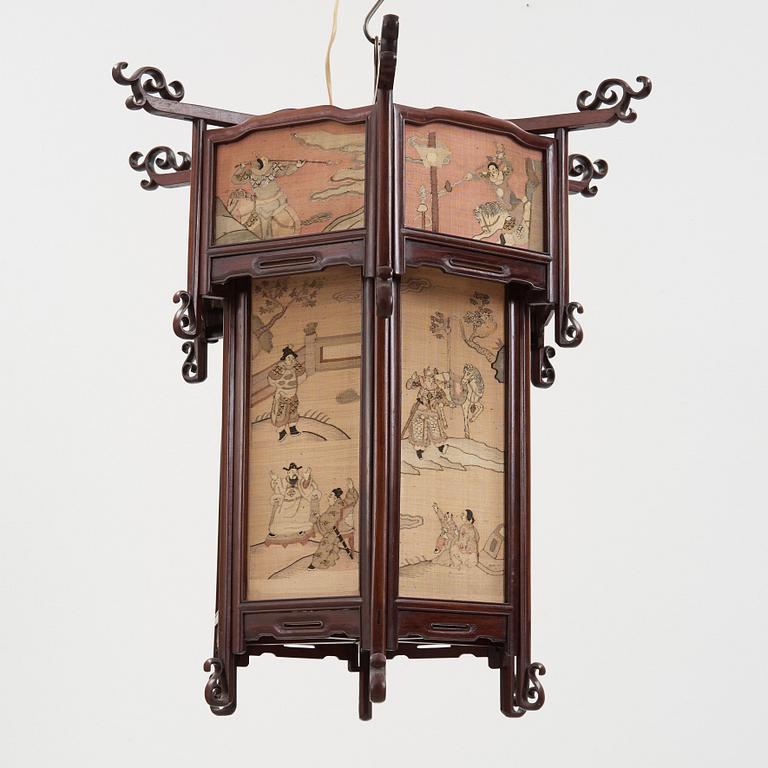 A lantern with panels of kesi woven silk, Qing dynasty, circa 1900.