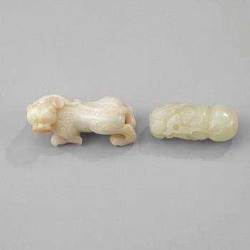 Two chinese nephrite figures of a buddhist lion and a monkey on a calabash.