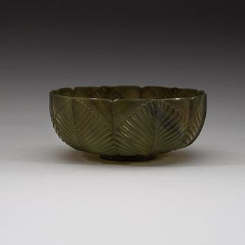 A thinly-carved translucent spinach jade of lobed and barbed hexafoil form, Qing dynasty
19th century.