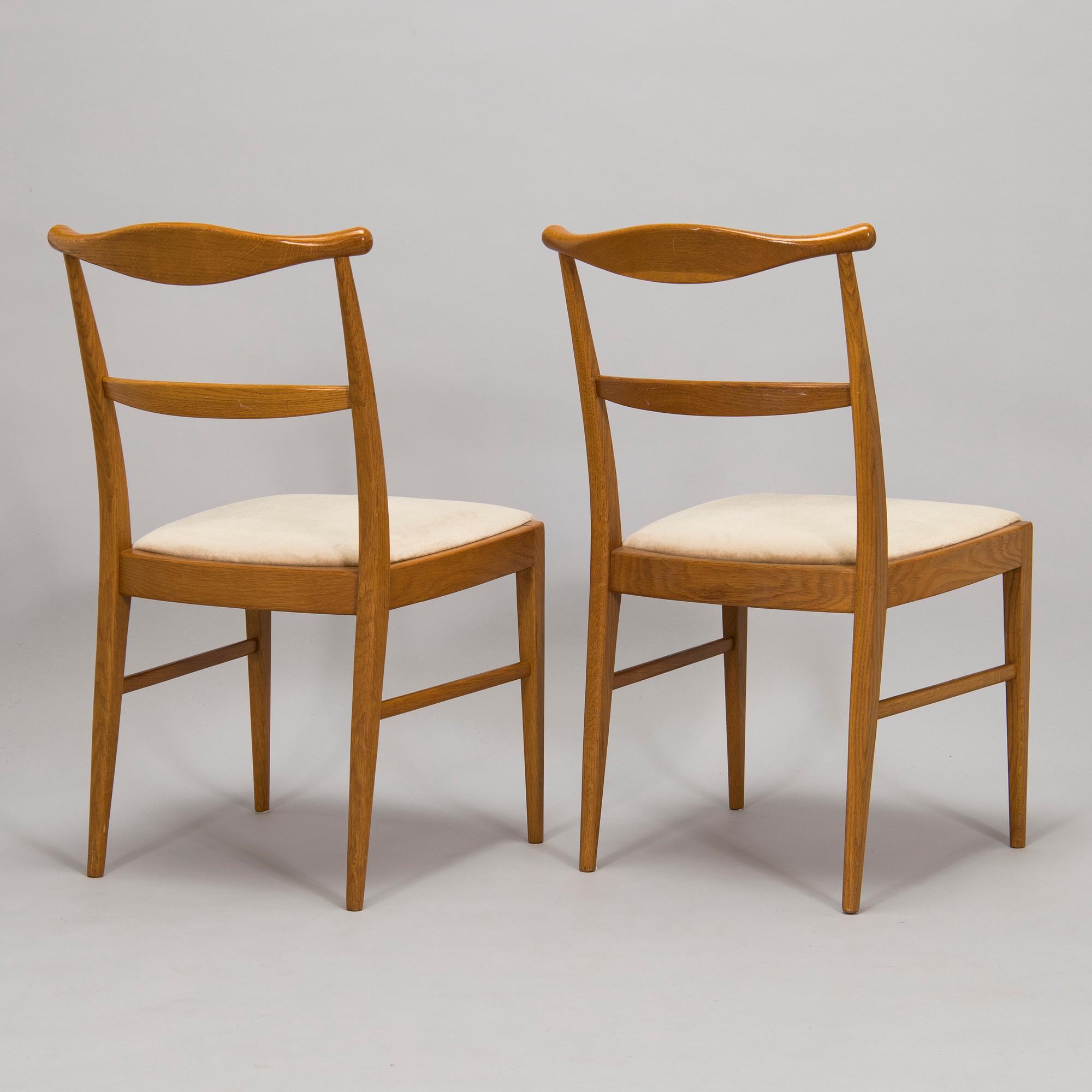 A set of four 1960s oak chairs.