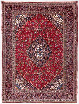 An Oriental carpet, c. 396 x 300 cm.