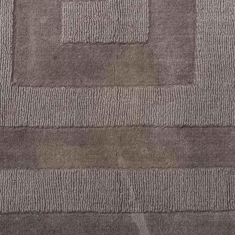 A Layered "Wool Cubes" carpet, 390x620 cm.
