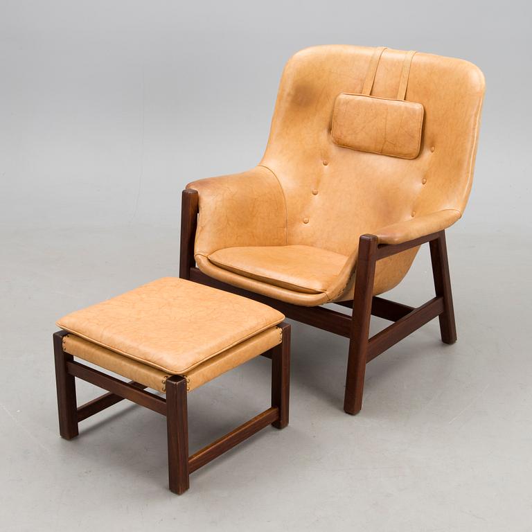 A 1960s 'Caravelle' armchair and ottoman for Puunveisto Oy - Träsnideri Ab, Finland.