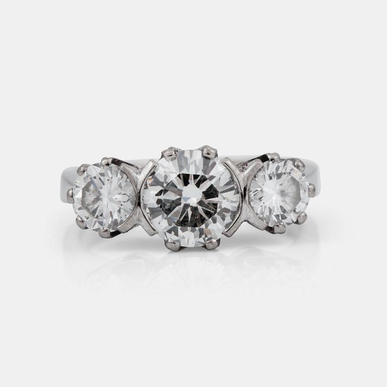 A three stone diamond ring.