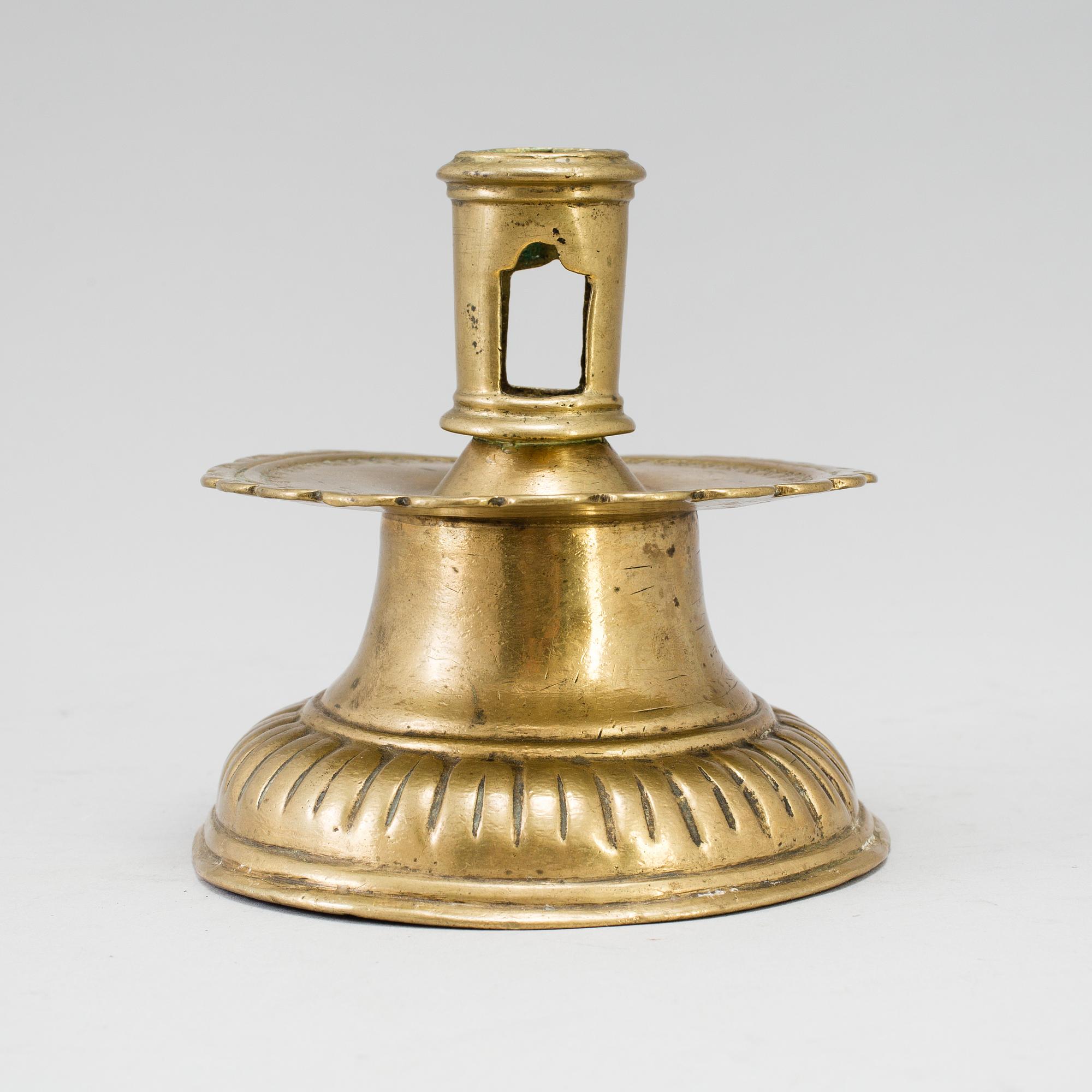 A 16th century bronze candlestick.