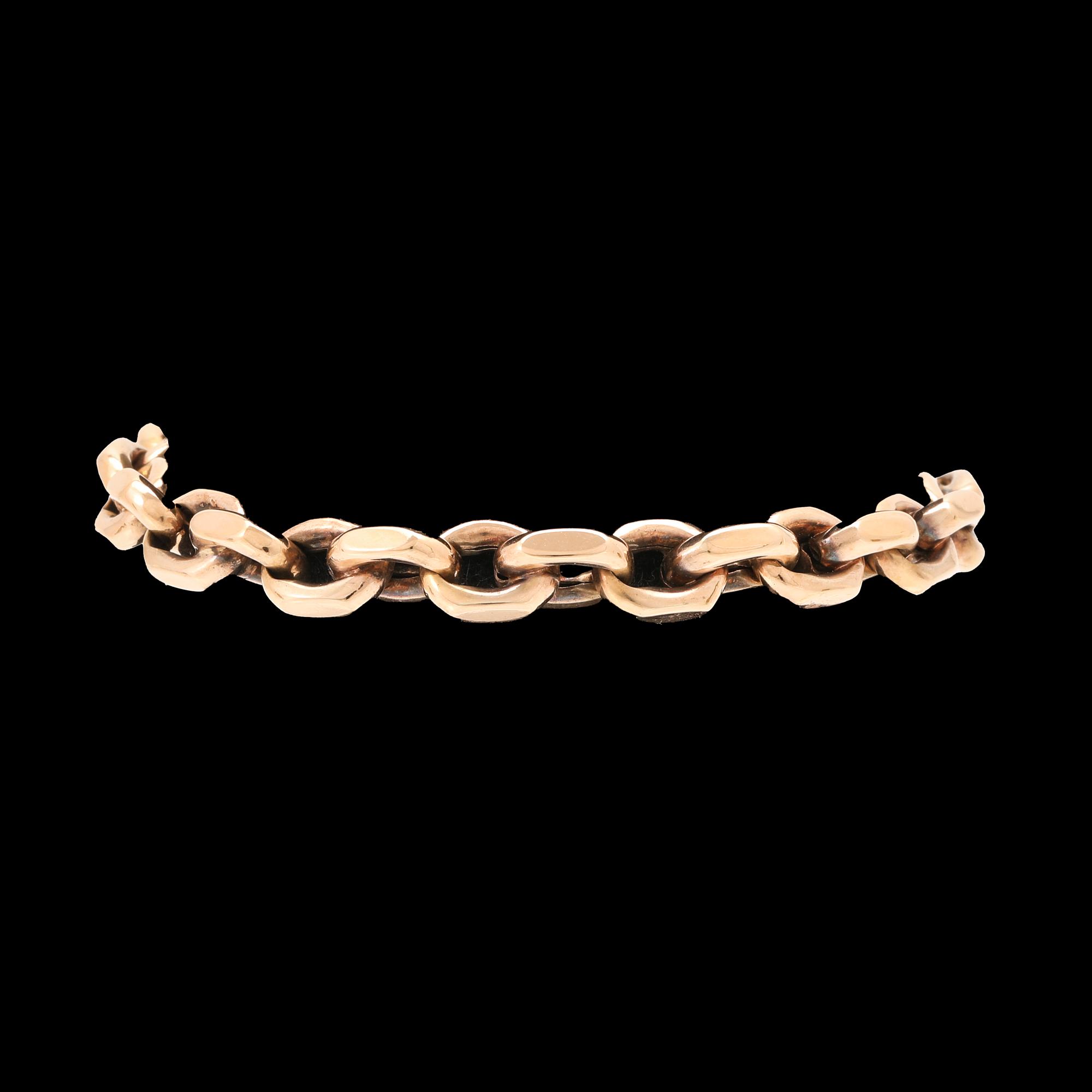 An 18K gold anchor link bracelet.