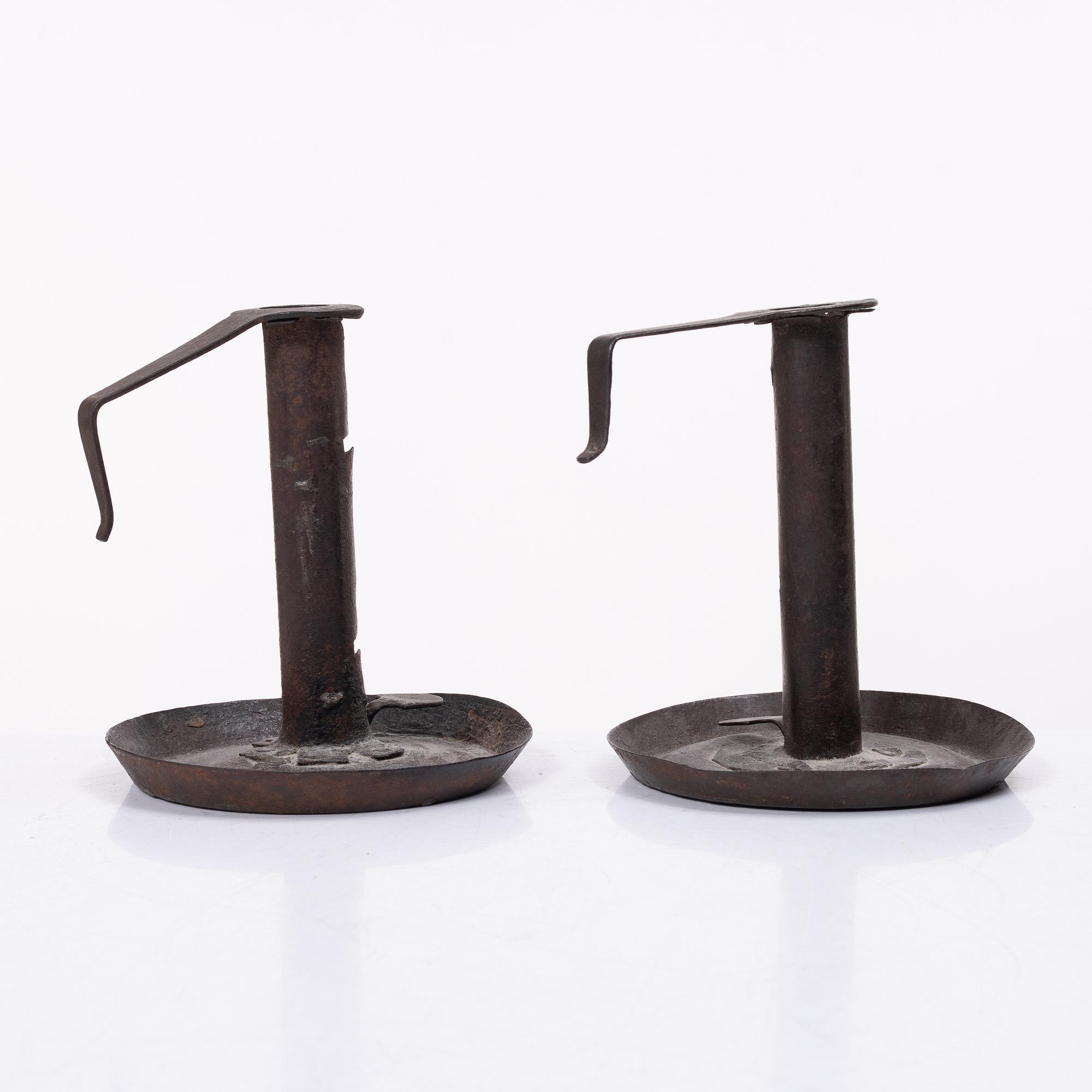 A pair of similar candle holders, 19th century.
