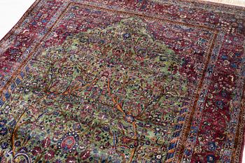 An antique silk Kashan carpet, central Persia, c. 319 x 206 cm.